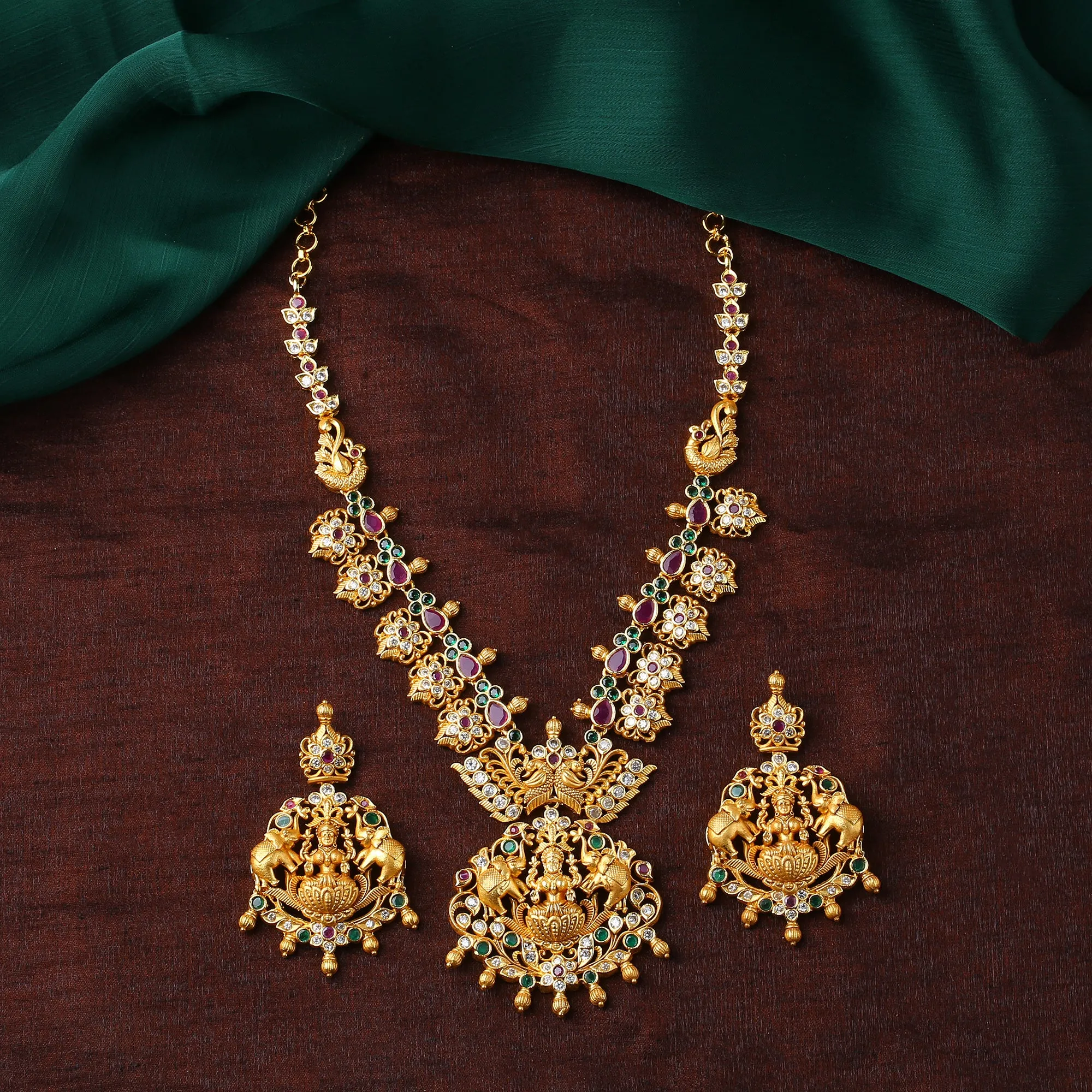 Estele Gold Plated CZ Traditional Laxmi Ji Decorated Bridal Short & Long Necklace Set with Color Stones