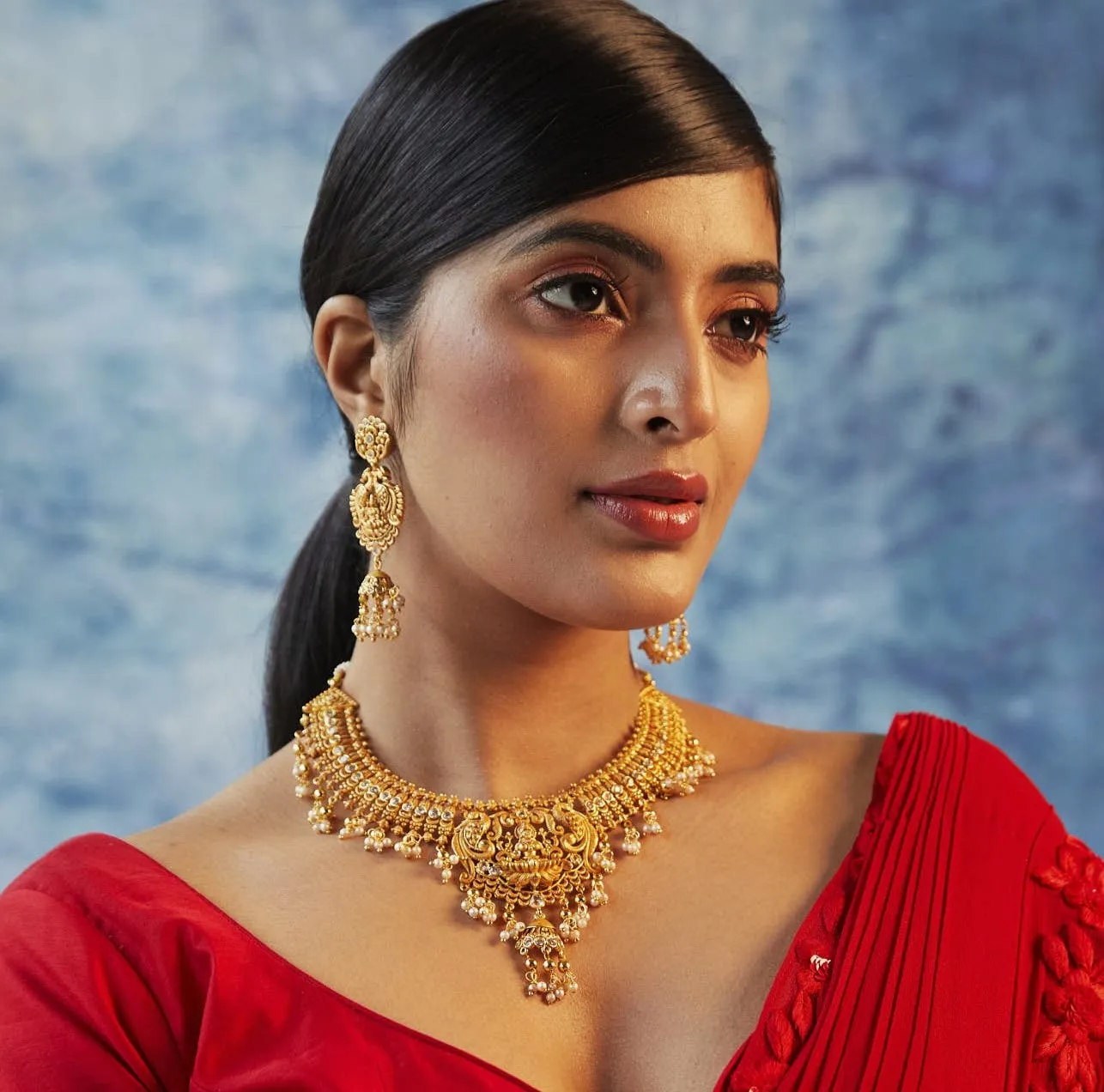 Estele Gold plated Divine Lakshmi Ji Temple Necklace set with color stones & Pearls